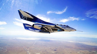 In this May 29, 2018 photo provided by Virgin Galactic, the VSS Unity craft flies during a supersonic flight test. Virgin Galactic has received nearly 8,000 online reservations of interest since its first successful test flight into space 14 months ago, the company said Tuesday, Feb. 25, 2020, as it nears commercial operation and prepares to reopen ticket sales.