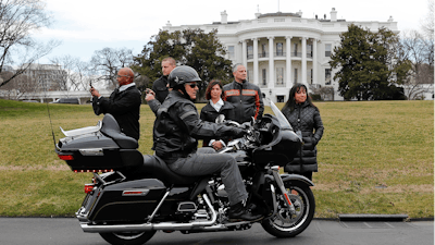 Harley Davidson President and CEO Matthew S. Levatich rides his motorcycle onto the South Lawn of the White House in Washington before a meeting with President Donald Trump and Vice President Mike Pence.