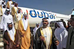 In this Nov. 15, 2009 file photo, Sheikh Mohammed bin Rashid Al Maktoum, Vice President and Prime Minister of the United Arab Emirates and ruler of Dubai, 3rd right, visits a FlyDubai aircraft at the Dubai Airshow in Dubai, United Arab Emirates.