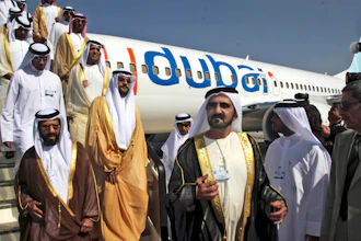 In this Nov. 15, 2009 file photo, Sheikh Mohammed bin Rashid Al Maktoum, Vice President and Prime Minister of the United Arab Emirates and ruler of Dubai, 3rd right, visits a FlyDubai aircraft at the Dubai Airshow in Dubai, United Arab Emirates.