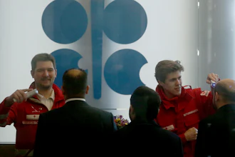 Austrian rescue personnel checks the body temperature of participants before meeting of the Organization of the Petroleum Exporting Countries, OPEC at their headquarters in Vienna, Austria, Thursday, March 5, 2020.
