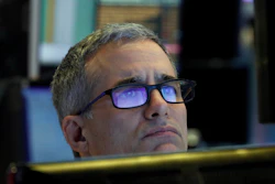Specialist Anthony Rinaldi prepares for the day's trading, on the floor of the New York Stock Exchange, Thursday, March 5, 2020.