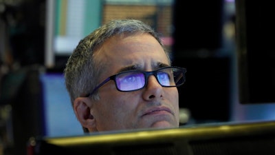 Specialist Anthony Rinaldi prepares for the day's trading, on the floor of the New York Stock Exchange, Thursday, March 5, 2020.