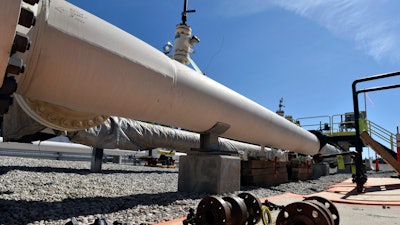 In this June 8, 2017, file photo, fresh nuts, bolts and fittings are ready to be added to the east leg of the pipeline near St. Ignace, Michigan.