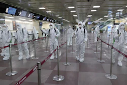 South Korean army soldiers wearing protective suits spray disinfectant to prevent the spread of the new coronavirus at Daegu International Airport in Daegu, South Korea on Friday, March 6.