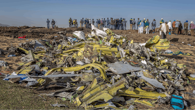 In this March 11, 2019, file photo, wreckage is piled at the crash scene of Ethiopian Airlines flight ET302 near Bishoftu, Ethiopia.