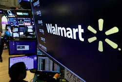 In this Feb. 18, 2020 file photo, the logo for Walmart appears above a trading post on the floor of the New York Stock Exchange.