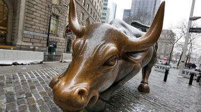 This Feb. 7, 2018 file photo shows the Charging Bull sculpture by Arturo Di Modica, in New York's Financial District. The longest bull market in U.S. history is over after nearly 11 years. The bull market officially ran from March 9, 2009, until Feb. 19, 2020, when it began the 20% dive that has taken it into bear market territory as of Thursday, March 12.