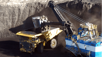 In this Nov. 15, 2016, file photo, a mechanized shovel loads coal from an 80-feet thick seam at the Spring Creek mine near Decker, Mont.