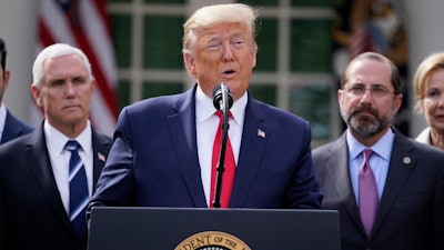 President Donald Trump speaks during a news conference about the coronavirus in the Rose Garden of the White House, Friday, March 13 in Washington.