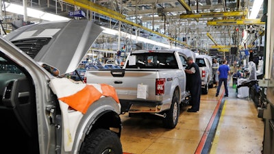 DETROIT (AP) — Detroit's three automakers have agreed to partial factory shutdowns, deep cleaning of equipment and longer periods between shifts to head off union demands for U.S. plant closures due to the coronavirus threat. The agreements came Tuesday night after union officials spoke individually with General Motors, Ford and Fiat Chrysler. The companies also agreed to “extensive plans” to avoid union members coming in contact with one another, the United Auto Workers union said in a statement. The union said earlier in the day that it wanted the automakers to shut down their factories for two weeks to keep its members safe from the spreading coronavirus. Each company agreed to different provisions depending on its situation, but generally, automakers agreed to cut shifts on a rotating basis, which would idle factories for long periods to clean the building and equipment. Some companies agreed to cut overtime work to build space between shifts for added cleaning. Details of how to keep workers apart were still being worked out and more announcements will be coming in the next 24 hours, the union said in a statement. “All three companies have agreed to new measures that will increase adherence to CDC (Centers for Disease Control) recommendations on social distancing in the workplace,” the statement said. Officials have recommended that people not gather in large groups and try to stay at least 6 feet (about 2 meters) from each other to stop the virus that causes COVID-19 from spreading. Earlier Tuesday UAW President Rory Gamble said in an email to members that the companies were not willing to stop production when the union asked for it Sunday. Gamble says the union gave Ford, General Motors and Fiat Chrysler two days to put together plans to safeguard workers. That period ended Tuesday afternoon. Gamble said if the union isn't satisfied it will take unspecified further action to protect members. The three companies employ about 150,000 auto workers at dozens of factories and parts depots across the country. Most of the manufacturing footprint is concentrated in the industrial Midwest, but the companies also have plants in Kentucky, Tennessee, Texas and other states. The dispute came as union members complained that continued work at the plants would expose them to the virus. Industry analysts have said it will be difficult to keep the factories open for very long as the COVID-19 virus spreads. Fiat Chrysler, Ford, Volkswagen, Daimler AG and PSA Groupe have closed their European factories to help stop the virus from spreading. “There's very few industries where you get this many people together and they all touch the same things,” said Kristin Dziczek, vice president of labor and manufacturing for the Center for Automotive Research, an industry think tank in Michigan. GM believes it can run the plants safely with preventive measure it has put in place since January and enhancements it is working on, spokesman Jim Cain said. Fiat Chrysler says it already has put “extensive protocols” in place to ensure the health and safety of workers. “We are continuing to carefully monitor the situation and are making improvements as needed,” spokeswoman Jodi Tinson said in a statement. Ford said it's working closely with the union and will announce details later. Analysts expect U.S. auto sales to take a nosedive as people stay home to avoid other people. The industry likely has enough inventory to satisfy slower demand due to the virus, they have said. Ford reported Tuesday that sales had fallen in Europe and that parts supplies have been interrupted. On Sunday, the union and companies announced they would form a task force to deal with worker safety as the plants continued operating. Seventeen workers at a Fiat Chrysler factory in Warren, Michigan, walked off their jobs in the paint shop Monday over concerns about the novel coronavirus. A worker at an FCA transmission plant in Kokomo, Indiana, tested positive for the virus last week. He and nearby co-workers were told to stay home and his work area was deep cleaned. Production continued at both factories.