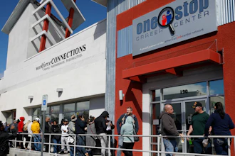 People wait in line for help with unemployment benefits at the One-Stop Career Center, Tuesday, March 17, 2020, in Las Vegas.