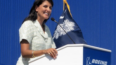 In this June 10, 2011 file photo former South Carolina Gov. Nikki Haley speaks during the dedication of Boeing Co.'s $750 million final assembly plant in North Charleston, S.C.