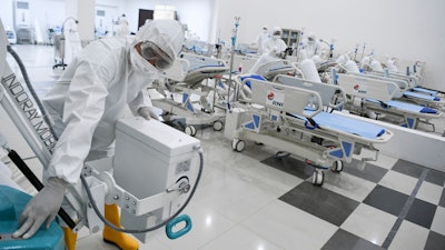 Staff inspect medical equipments at an emergency hospital set up amid the new coronavirus outbreak in Jakarta, Indonesia on Monday, March 23.