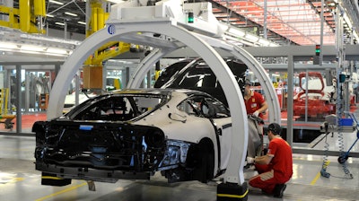 A technician works at the Ferrari department factory in Maranello, Italy.