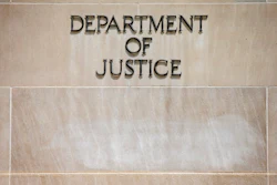 In this June 19, 2015, file the Justice Department Building in Washington. The Justice Department says pharmaceutical company Sandoz Inc. will pay a $195 million penalty to resolve criminal charges of conspiring to fix prices and rig bids for generic drugs. Officials say Monday, March 2, 2020, that the company would admit guilt and pay the penalty.