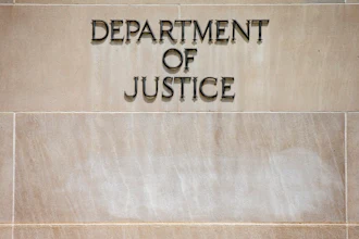 In this June 19, 2015, file the Justice Department Building in Washington. The Justice Department says pharmaceutical company Sandoz Inc. will pay a $195 million penalty to resolve criminal charges of conspiring to fix prices and rig bids for generic drugs. Officials say Monday, March 2, 2020, that the company would admit guilt and pay the penalty.