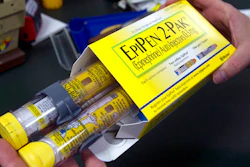 In this July 8, 2016, file photo, a pharmacist holds a package of EpiPens epinephrine auto-injector, a Mylan product, in Sacramento, Calif. On Tuesday, March 24, 2020, the U.S. Food and Drug Administration warned the public about malfunctions involving some EpiPens, the emergency injectors for severe allergic reactions.