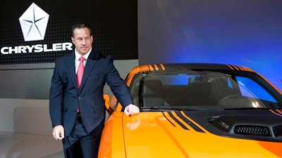 In this Feb. 13, 2014 file photo, Reid Bigland unveils the Dodge Challenger Shaker at the Canadian International Auto Show in Toronto. Fiat Chrysler's head of U.S. sales is leaving the automaker after more than two decades. Bigland had a bumpy career that saw huge growth but also a whistleblower lawsuit over a scheme to pay dealers to report fake sales numbers. The Italian-American company says Bigland will leave April 3, 2020.