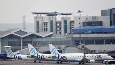 Flybe passenger planes are parked at Birmingham Airport, as Flybe, Europe's biggest regional airline, has collapsed into administration, in Birmingham, England, Thursday March 5, 2020. UK Civil Aviation Authority (CAA) said Thursday that financially troubled Flybe had entered administration, leaving passengers stranded and told to find their own way home.