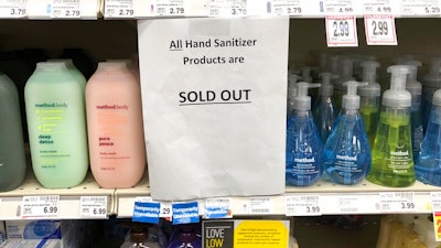 A sign on a shelf at a QFC grocery store in Kirkland, Wash., advises shoppers, Tuesday, March 3, 2020, that all hand sanitizer products are sold out. Fear of the coronavirus has led people to stock up on the germ-killing gel, leaving store shelves empty and online retailers with sky-high prices set by those trying to profit on the rush. The store is located near the Life Care Center of Kirkland, which has been tied to several cases of the COVID-19 coronavirus.