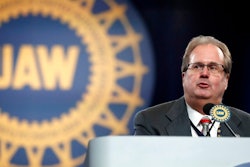 In this March 11, 2019 file photo, Gary Jones, president of the United Auto Workers union addresses delegates to the union's bargaining convention in Detroit. An expected guilty plea to corruption charges by former United Auto Workers President Gary Jones has been delayed due to the coronavirus and traveling concerns. Jones was to appear in federal court in Detroit on Thursday, March 12, 2020. He's accused of conspiring with UAW cronies to embezzle more than $1 million.