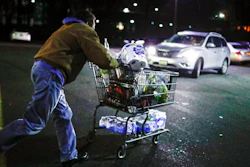 Customer Harry Westhoff, 71, runs his groceries back to his car after shopping at a Stop & Shop supermarket that opened special morning hours to serve people 60-years and older due to coronavirus concerns, Friday, March 20, 2020, in Teaneck, N.J. For most people, COVID-19, the disease caused by the new coronavirus, causes only mild or moderate symptoms, such as fever and cough. For some, especially older adults and people with existing health problems, it can cause more severe illness, including pneumonia.