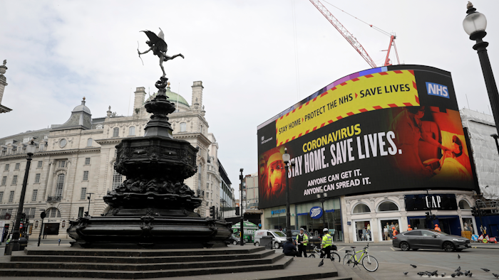 A video screen displays a message urging people to stay home, at Piccadilly Circus in London on Wednesday, April 8. The highly contagious COVID-19 coronavirus has impacted on nations around the globe, many imposing self isolation and exercising social distancing when people move from their homes.