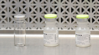This March 16, 2020 file photo shows vials used by pharmacists to prepare syringes used on the first day of a first-stage safety study clinical trial of the potential vaccine for COVID-19.