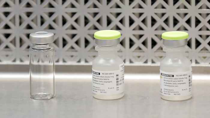 This March 16, 2020 file photo shows vials used by pharmacists to prepare syringes used on the first day of a first-stage safety study clinical trial of the potential vaccine for COVID-19.