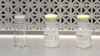 This March 16, 2020 file photo shows vials used by pharmacists to prepare syringes used on the first day of a first-stage safety study clinical trial of the potential vaccine for COVID-19.