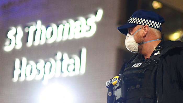 A police officer stands outside St Thomas' Hospital in central London as British Prime Minister Boris Johnson was moved to intensive care after his coronavirus symptoms worsened on Monday April 6, 2020. Johnson was admitted to St Thomas' hospital in central London on Sunday after his coronavirus symptoms persisted for 10 days. Having been in hospital for tests and observation, his doctors advised that he be admitted to intensive care on Monday evening.