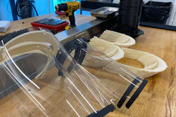 In this Friday, March 27, 2020, photo provided by NASCAR, safety splash shields are made at the NASCAR Research and Development Center in Concord, N.C.