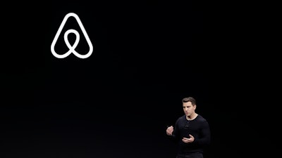 Airbnb co-founder and CEO Brian Chesky speaks during an event in San Francisco.