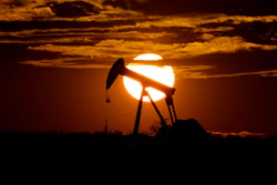 The sun sets behind an idle pump jack near Karnes City, Texas, Wednesday, April 8, 2020. Demand for oil continues to fall due to the new coronavirus outbreak.