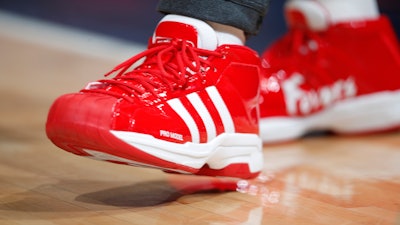 New Orleans Pelicans forward Derrick Favors wears Christmas-themed Adidas Pro Model Superstars shoes in the first half of an NBA basketball game Wednesday, Dec. 25, 2019, in Denver, USA.