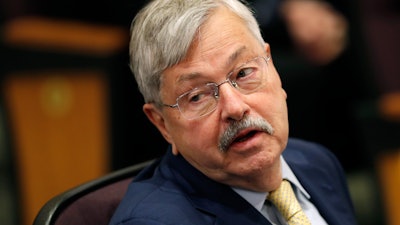 U.S. Ambassador to China Terry Branstad listens to Secretary of State Mike Pompeo speak at an event in Johnston, Iowa.