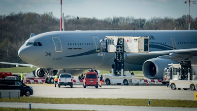 An Airbus A330 of the French Air Force is on display at the Airport of Hamburg, Germany, Tuesday, March 31, 2020. The plane will fly six corona patients who need to be ventilated to Germany for treatment. In order to slow down the spread of the coronavirus, the German government has considerably restricted public life and asked the citizens to stay at home. The new coronavirus causes mild or moderate symptoms for most people, but for some, especially older adults and people with existing health problems, it can cause more severe illness or death.