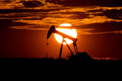In this Wednesday, April 8, 2020, file photo, the sun sets behind an idle pump jack near Karnes City, Texas. Demand for oil continues to fall due to the new coronavirus outbreak. As demand for fuel plummeted worldwide and the oil industry faced a devastating drop in oil prices, the U.S. took the rare move of stepping into negotiations involving the member countries of OPEC and non-members such as Russia and Mexico.