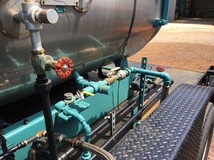 A boiler steam line on a 50 hp boiler mounted on a mobile flat open trailer.