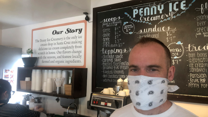 In this April 17, 2020, photo, Zachary Davis poses for a photo at The Penny Ice Creamery in Santa Cruz, Calif.
