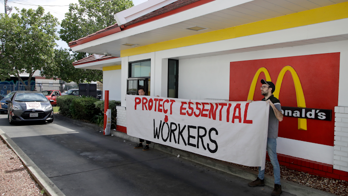 People protest what they say is a lack of personal protective equipment for employees.