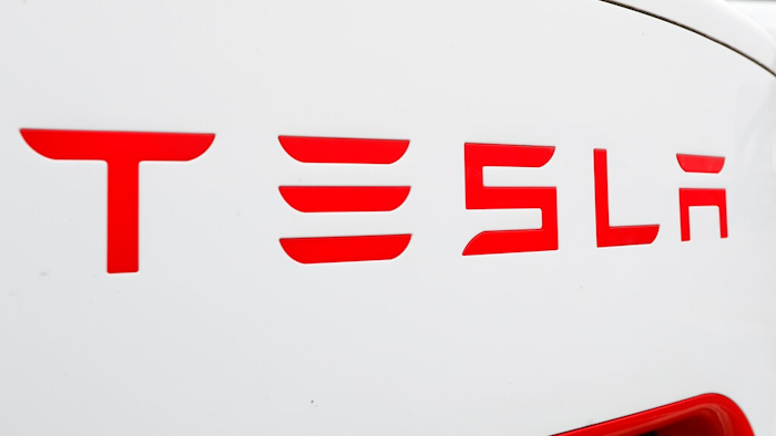 This Wednesday, March 18, 2020, file photo, shows a Tesla charging station for automobiles in Port Huron, Mich. Tesla's sales of its increasingly popular electric cars got off to a fast start in the year, even though the company had to slam the brakes along with other major automakers in March 2020 because of worldwide efforts to contain the worst pandemic in a century.