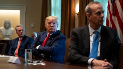 House Minority Leader Kevin McCarthy of Calif., President Donald Trump, and Chevron CEO Mike Wirth listen during a meeting.