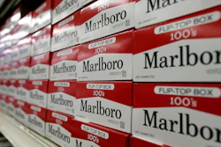 This June 14, 2018, file photo shows cartons of Marlboro cigarettes on the shelves at JR outlet in Burlington, N.C.