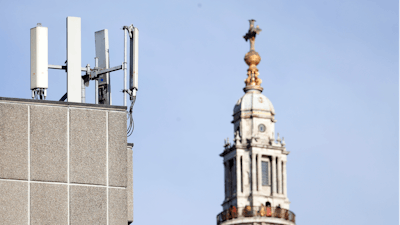 In this Tuesday, Jan 28, 2020 file photo, mobile network phone masts are visible in front of St Paul's Cathedral in the City of London.