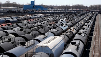 Oil tank train cars sit idle, April 21, 2020, in East Chicago, Ind.