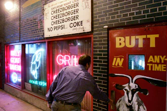 A customer enters the Billy Goat Tavern under Chicago's Michigan Ave.