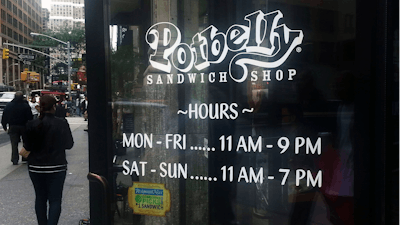 People walk past a Potbelly Sandwich shop in New York.