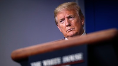 In this April 22, 2020, file photo, President Donald Trump listens during a briefing about the coronavirus in the James Brady Press Briefing Room of the White House, in Washington.